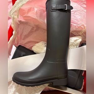 Black size 7 women’s Hunter boots, never worn brand new.